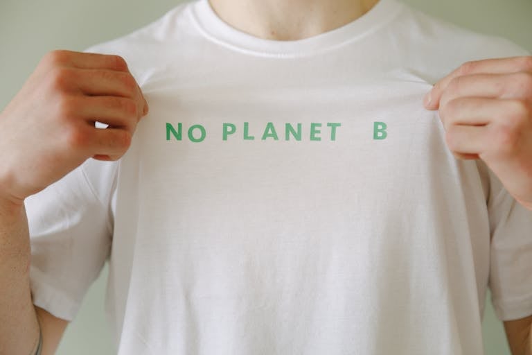 A Person in White Crew Neck T-shirt with Printed Message