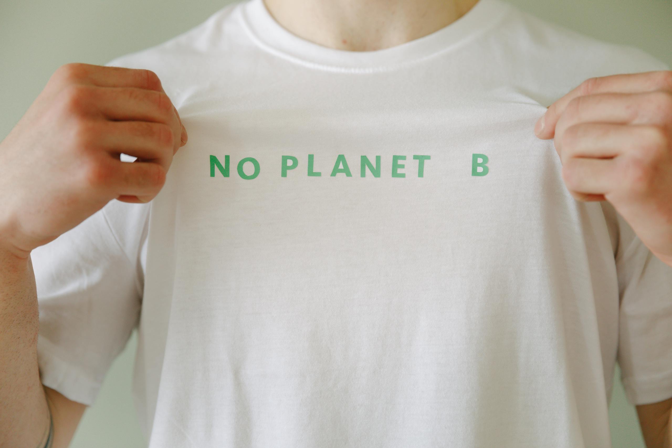 A Person in White Crew Neck T-shirt with Printed Message